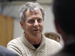U.S. Sen. Sherrod Brown, D-Ohio, smiles as he speaks with guests prior to an economic roundtable discussion at Winnacunnet High School in Hampton, N.H., Friday, Feb. 8, 2019. Sen. Brown is weighing a run for in 2020 presidential race.