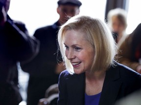 Sen. Kirsten Gillibrand, D-NY, smiles as she listens to a patron while visiting a coffee shop on Main Street in Concord, N.H., Friday, Feb. 15, 2019. Gillibrand visited New Hampshire as she explores a 2020 run for president.