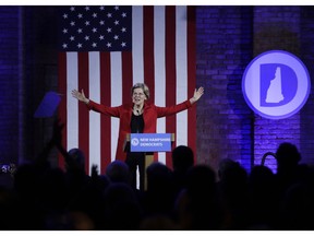 Democratic presidential candidate Sen. Elizabeth Warren, D-Mass., acknowledges applause at the New Hampshire Democratic Party's 60th Annual McIntyre-Shaheen 100 Club Dinner, Friday, Feb. 22, 2019, in Manchester, N.H.