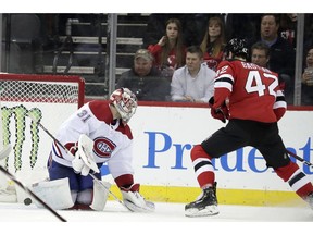 New Jersey Devils right wing Nathan Bastian (42) scores his first career goal against Montreal Canadiens goaltender Carey Price (31) during the first period of an NHL hockey game, Monday, Feb. 25, 2019, in Newark, N.J.