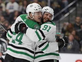 Dallas Stars center Tyler Seguin (91) celebrates after left wing Roope Hintz (24) scored against the Vegas Golden Knights during the first period of an NHL hockey game Tuesday, Feb. 26, 2019, in Las Vegas.