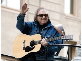 FILE - In this Nov. 22, 2012 file photo, Don McLean rides a float in the Macy's Thanksgiving Day Parade in New York. Don McLean has threatened to sue a weekly newspaper that wrote about his former wife's photo exhibition about domestic abuse, which includes a copy of the protection order issued against him., Friday, Feb. 22, 2019.