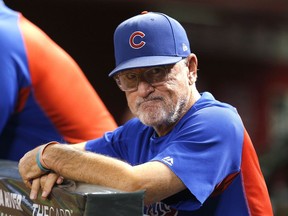 FILE - In this Sept. 18, 2018, file photo, Chicago Cubs manager Joe Maddon stands at the rail during the first inning of the team's baseball game against the Arizona Diamondbacks in Phoenix. Maddon did not receive a contract extension, sending him into the final year of his current deal with an uncertain future.