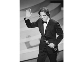 FILE - In this March 29, 1982, file photo, Warren Beatty waves to the audience as he leaves the stage after accepting the Oscar for directing, for the movie "Reds," at the Academy Awards in Los Angeles. Years before Jared Goff or any of today's Los  Angeles Rams were born, Beatty had been carried off on his teammates' shoulders to celebrate a Rams title that only Hollywood could dream up. He played quarterback Joe Pendleton in the 1978 Academy Award nominated movie "Heaven Can Wait." At the end, he leads LA to an otherworldly Super Bowl victory over the Steelers.