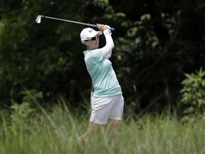 FILE - In this June 27, 2018, file photo, Karrie Webb, of Australia, watches her tee shot on the 17th hole during a practice round for the KPMG Women's PGA Championship golf tournament at Kemper Lakes Golf Course in Lake Zurich, Ill. Webb's bid for a sixth Women's Australian Open title began with a 5-under 67 at The Grange, Thursday, Feb. 14, 2019, leaving her two strokes behind first-round leaders Jodi Ewart Shadoff and Wei-Ling Hsu.