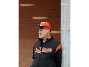 FILE - In this Feb. 13, 2019, file photo, San Francisco Giants manager Bruce Bochy watches his team during a baseball spring training practice, in Scottsdale, Ariz. Bochy says he will retire after this season, his 25th as a big league manager. Bochy says he told the team of his decision on Monday, Feb. 18, 2019.