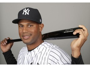 FILE - This is a 2019 file photo showing Aaron Hicks of the New York Yankees baseball team. A person familiar with the negotiations tells The Associated Press that outfielder Aaron Hicks and the New York Yankees have agreed to a $70 million, seven-year contract that adds $64 million in guaranteed money over six seasons. Hicks' agreement includes a club option for 2026 that could make it worth $81.5 million over seven seasons, the person said Monday, Feb. 25, 2019. The person spoke on condition of anonymity because the agreement had not yet been announced.