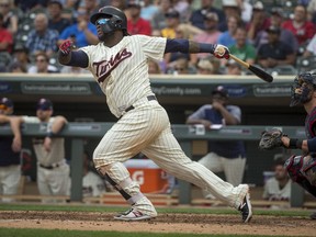 FILE - In this Aug. 1, 2018, file photo, Minnesota Twins' Miguel Sano bats against the Cleveland Indians in the seventh inning of a baseball game, in Minneapolis. One of the first things on manager Rocco Baldelli's to-do list was to travel to the Atlanta area and the Dominican Republic to start getting to know Byron Buxton and Sano.