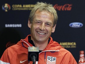 FILE - In this June 20, 2016, file photo, then-U.S. men's soccer coach Jurgen Klinsmann talks to reporters during a Copa America Centenario news conference, in Houston.  Jurgen Klinsmann received a $3.35 million settlement of his contract with the U.S. Soccer Federation, according to the USSF's tax filing. His replacement, Bruce Arena, was given a $300,000 settlement during the fiscal year that ended March 31, 2018, according to the filing, which was released Monday, Feb. 18, 2019.