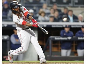 FILE - In this May 9, 2018, file photo, Boston Red Sox's Hanley Ramirez hits a seventh-inning, two-run home run off New York Yankees relief pitcher Chad Green in a baseball game in New York. Free agent slugger Hanley Ramirez has signed with the Indians, who hope he can give them some power. The 35-year-old Ramirez passed his physical and reported to training camp on Tuesday, Feb. 26, 2019.