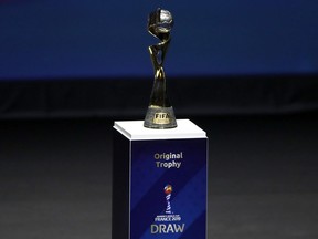 FILE - In this Dec. 8, 2018, file photo, the Women's World Cup trophy is displayed at the women's soccer 2019 World Cup draw, in Boulogne-Billancourt, outside Paris. Wednesday marks 100 days until kickoff for the game's biggest tournament, opening on June 7 in Paris. The 24-team event will be played at nine stadiums in France over the course of a month, with the final set for July 7 in Lyon.