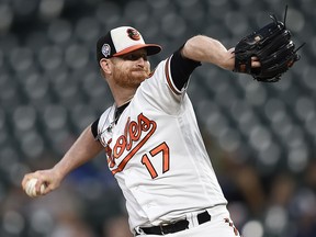 FILE - In this Sept. 11, 2018, file photo, Baltimore Orioles pitcher Alex Cobb throws against the Oakland Athletics in the first inning of a baseball game, in Baltimore. Cobb is among a handful of veterans sure to make the 25-man roster.