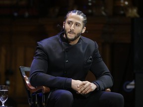 FILE - In this Oct. 11, 2018, file photo, former NFL football quarterback Colin Kaepernick attends the W.E.B. Du Bois Medal ceremonies at Harvard University in Cambridge, Mass. Kaepernick was among eight recipients of Harvard University's W.E.B. Du Bois Medals in 2018. A person with knowledge of the conversation tells The Associated Press that the new Alliance of American Football spoke with Kaepernick during its development about joining the league. But Kaepernick wanted $20 million or more to consider playing with the league that had its debut last weekend. The person spoke on condition of anonymity Thursday because neither side has publicly acknowledged such talks.