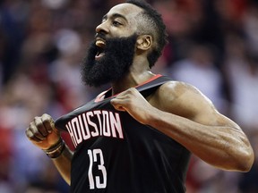 FILE - In this Dec. 17, 2018, file photo, Houston Rockets guard James Harden reacts after making a three-point basket late in the second half of an NBA basketball game against the Utah Jazz, in Houston. Harden has a shot at the record for 3s in a single season. He has 274 (which would be fifth-best for a season already), putting him on pace for 401 if he plays in all 25 of the Rockets' remaining games. Golden State's Stephen Curry holds the mark with 402 makes from deep in 2015-16.