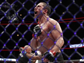 FILE - In this June 10, 2018, file photo, Robert Whittaker reacts after his middleweight mixed martial arts title bout against Yoel Romero at UFC 225 in Chicago. Whittaker defends his UFC middleweight title against Kelvin Gastelum in the main event of UFC 234 in Melbourne, Australia, on Sunday.