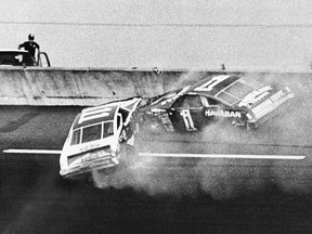 FILE - In this Feb. 18, 1979, file photo, Donnie Allison, in car 1, and Cale Yarborough, in car 11, crash on the last lap of the Daytona 500 which put Richard Petty in Victory Lane in Daytona Beach, Fla. Donnie Allison and his brother Bobby ended up in a fight with Cale Yarborough because of the wreck. The 1979 race was instrumental in broadening NASCAR's southern roots. Forty years later, it still resonates as one of the most important days in NASCAR history.