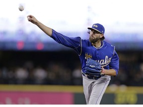 FILE - In this June 30, 2018, file photo, Kansas City Royals starting pitcher Jason Hammel works against the Seattle Mariners during the first inning of a baseball game in Seattle. Free agent right-hander Hammel has agreed to a minor league deal with the Texas Rangers and will report to major league spring training.
