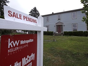 FILE- This June 15, 2018, file photo shows a "sale pending" sign is posted outside a home in East Derry, N.H. On Wednesday, Feb. 27, 2019, the National Association of Realtors releases its January report on pending home sales, which are seen as a barometer of future purchases.