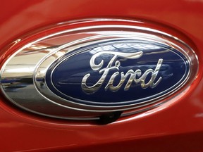 FILE- In this Feb. 14, 2019, file photo this is the Ford logo on a 2019 Ford Ranger 2019 Supercrew 4x4 on display at the 2019 Pittsburgh International Auto Show in Pittsburgh. Ford says it has launched an investigation into whether a flawed mathematical model caused it to overstate gas mileage and understate pollution from a wide range of vehicles. The company says a group of employees reported possible problems with the model in September. So it has hired an outside firm to test the 2019 Ford Ranger.