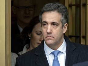 FILE - In this Dec. 12, 2018 file photo, Michael Cohen, President Donald Trump's former lawyer, leaves federal court after his sentencing in New York. A judge has agreed to postpone the start of Cohen's prison sentence by two months to May 6. New York Judge William Pauley signed off on the delay Wednesday, Feb. 20, 2019, after Cohen's lawyer said he needed more time to recover from shoulder surgery. They noted prosecutors did not object to the one-time extension.