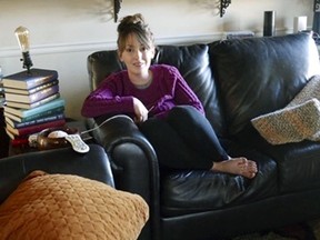 In this 2019 photo provided by Americans United for Separation of Church and State, Aimee Maddonna poses at her home in Simpsonville, S.C. The South Carolina mother has sued both the state and federal government, saying she's a victim of religious discrimination on the part of a federally funded foster-care agency that turned her down because of her Catholic faith. Maddonna says the agency in 2014 initially encouraged her to become a foster parent but cut off ties once realizing that she is Catholic and not a "born-again" Christian, as the agency's internal rules require. (Courtesy of Aimee Maddonna/Americans United for Separation of Church and State via AP)