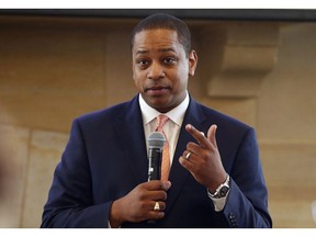 FILE- In this Sept. 25, 2018, file photo, Virginia Lt. Gov. Justin Fairfax gestures during remarks before a meeting of the Campaign to reduce evictions at a church meeting room in Richmond, Va. A California woman has accused Fairfax of sexually assaulting her 15 years ago, saying in a statement Wednesday, Feb. 6, 2019, that she repressed the memory for years but came forward in part because of the possibility that Fairfax could succeed a scandal-mired governor.