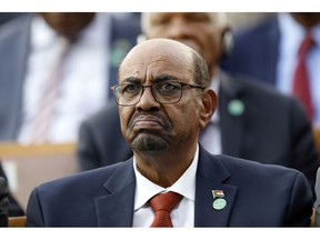 FILE - In this July 9, 2018, file photo, Sudan's President Omar al-Bashir attends a ceremony for Turkey's President Recep Tayyip Erdogan, at the Presidential Palace in Ankara, Turkey. Sudan's President has declared a state of emergency on Friday, Feb. 22, 2019, for a year and disbanded the government amid deadly protests. Al-Bashir -- who seized power in a 1989 coup-- also said Friday that for now he will not change the constitution to allow himself to seek a third term in office.