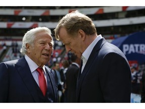 FILE - In this Nov. 19, 2017, file photo, NFL Commissioner Roger Goodell, right, talks with New England Patriots owner Robert Kraft before the Patriots face the Oakland Raiders in an NFL football game in Mexico City. Pending the completion of police investigations in Florida, and likely a league probe as well, Goodell could punish Kraft for being charged with two counts of soliciting a prostitute. The 77-year-old Kraft was twice videotaped in a sex act at a shopping-center massage parlor in Florida, police said Friday, Feb. 22, 2019.