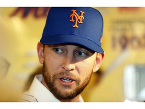 FILE - In this Jan. 16, 2019, file photo,  New York Mets infielder Jed Lowrie speaks to the media at CitiField following a baseball press conference in New York. The Mets said infielder Jed Lowrie will have an MRI of his left knee, which gave him problems after running last weekend.  He will go for a scan on Thursday, Feb. 21, 2019.