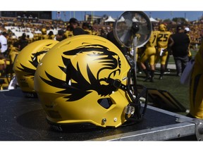 FILE - In this Sept. 22, 2018, file photo, a Missouri football helmet sits on the bench during the second half of an NCAA college football game against Georgia in Columbia, Mo. The NCAA has sanctioned Missouri's football, baseball and softball programs on Thursday, Jan. 31, 2019, after an investigation revealed academic misconduct involving a tutor who completed coursework for athletes.