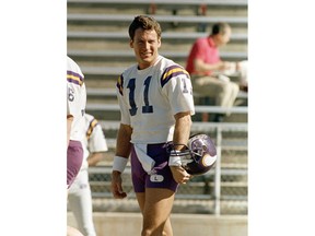 FILE - In this Jan. 8, 1988, file photo, Minnesota Vikings quarterback Wade Wilson is all smiles at the start of NFL football practice in Tucson, Ariz. The Cowboys say former NFL quarterback and longtime assistant coach Wade Wilson passed away Friday, Feb. 1, 2019, at his home in Coppell, Texas. The team didn't specify a cause of death for Wilson, who died on his 60th birthday. Wilson played for five NFL teams from 1981-98, including 10 seasons for the Vikings, leading them to the 1987 NFC Championship Game.