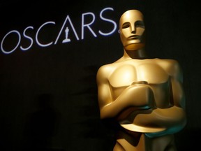 FILE - In this Feb. 4, 2019 file photo, an Oscar statue appears at the 91st Academy Awards Nominees Luncheon in Beverly Hills, Calif. A spokesperson for the Academy of Motion Picture Arts and Sciences said Monday that the awards for cinematography, film editing, makeup and hairstyling and live-action short will be presented off-air. The winning speeches will air later in the broadcast and will also be live-streamed on Oscar.com and the film academy's social accounts. The plan to change up the format in service of a truncated three-hour runtime was announced in August.