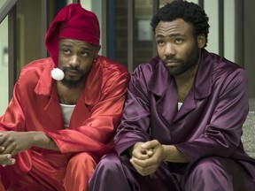 This image released by FX shows Lakeith Stanfield, left, and Donald Glover in a scene from the comedy series "Atlanta." Glover's comedy "Atlanta" will be back. Just not as soon as expected. FX Networks CEO John Landgraf told a TV critics' meeting on Monday, Feb. 4, that the series is behind schedule.