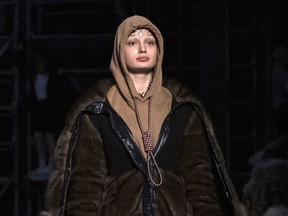 This Feb. 17, 2019 photo shows a model wearing a creation by Burberry at the Autumn/Winter 2019 fashion week runway show in London. The chief executive and chief creative officer of luxury powerhouse Burberry have apologized for putting a hoodie with strings tied in the shape of a noose on their London Fashion Week runway. Marco Gobbetti, the brand's CEO, said in a statement  that Burberry is "deeply sorry for the distress" the shirt has caused and has removed it from the autumn-winter collection. Riccardo Tisci, Burberry's creative director, also apologized. He said "while the design was inspired by a nautical theme, I realize that it was insensitive."