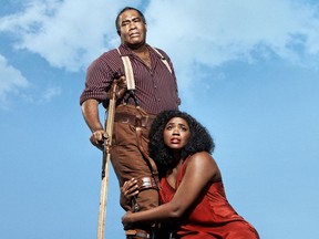 This undated image released by the Metropolitan Opera shows Eric Owens as Porgy, left, and Angel Blue as Bess in the Gershwins' "Porgy and Bess." The Metropolitan Opera will hire an all-black outside chorus next season for its first presentation in nearly three decades of the Gershwins' "Porgy and Bess," which opens the season on Sept. 23.