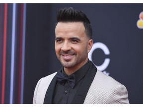 FILE - In this May 20, 2018 file photo, Luis Fonsi arrives at the Billboard Music Awards in Las Vegas. Fonsi will release a new album, "Vida," on Friday, Feb. 1, 2019.