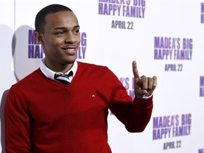 FILE - In this April 19, 2011 file photo, Shad Moss, also known as Bow Wow, arrives at the premiere of "Madea's Big Happy Family" in Los Angeles. Lawyers for a woman who was arrested along with the rapper Bow Wow following an altercation say she was a victim, not the aggressor. Atlanta police have said officers responded to a call in midtown Atlanta around 4:15 a.m. Saturday. Leslie Holden told them Bow Wow had assaulted her. Bow Wow told officers Holden assaulted him. Police say they couldn't determine who was the primary aggressor and both had minor injuries, so both were arrested and charged with battery.