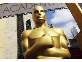 FILE - In this Feb. 21, 2015, file photo, an Oscar statue appears outside the Dolby Theatre for the 87th Academy Awards in Los Angeles. The 91st Academy Awards will be held on Sunday.