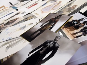 This Jan. 15, 2019 photo shows renderings of fashions created by Oscar nominated costume designer Ruth E. Carter for the film "Black Panther," foreground, among other sketches of costumes from her career, in Los Angeles. Carter will also be honored for her illustrious career at the 21st annual Costume Designers Guild Awards on Tuesday in Beverly Hills, Calif.