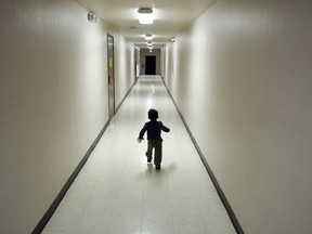 FILE - In this Dec. 11, 2018 file photo, an asylum-seeking boy from Central America runs down a hallway after arriving from an immigration detention center to a shelter in San Diego. Lawyers for eight immigrant families separated under Trump administration policy filed claims Monday, Feb. 11, 2019, against the U.S. government demanding $6 million each in damages for what they describe as lasting trauma.