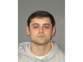 This undated photo provided by the East Baton Rouge Sheriff's Office shows Garrett Sanders. Louisiana State University announced the arrests Thursday, Feb. 14, 2019, of Sanders and eight other fraternity members for hazing-related crimes that included ordering pledges to lie in piles of broken glass, kicking pledges with steel-toed boots and urinating on them. (East Baton Rouge Sheriff's Office via AP)