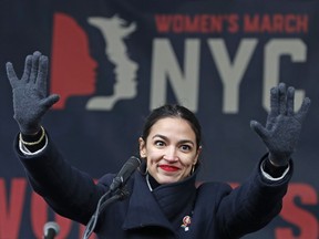 FILE - In this Jan. 19, 2019, file photo, U.S. Rep. Alexandria Ocasio-Cortez, D-New York, waves to the crowd after speaking at Women's Unity Rally organized by Women's March NYC at Foley Square in Lower Manhattan in New York. On Thursday, Feb. 14, newly-elected Rep. Alexandria Ocasio-Cortez led a chorus of cheers as Amazon announced it was abandoning plans to build a sought-after headquarters in New York City. Activists berated the online giant for a $3 billion package of tax breaks she said the city could better invest in hiring teachers or fixing the subway.