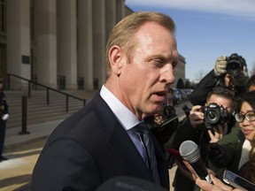 FILE - In this Jan. 28, 2019, file photo, acting Defense Secretary Pat Shanahan speaks with the media as he waits for the arrival of NATO Secretary General Jens Stoltenberg at the Pentagon in Washington. The Pentagon's top official, Shanahan, has arrived in Afghanistan to meet with U.S. commanders and Afghan leaders amid a push for peace with the Taliban.