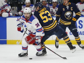 Buffalo Sabres forward Jeff Skinner (53) checks New York Rangers forward Mats Zuccarello (36) during the first period of an NHL hockey game, Friday, Feb. 15, 2019, in Buffalo N.Y.