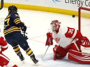 Buffalo Sabres forward Casey Mittelstadt (37) shoots the puck wide of Detroit Red Wings goalie Jimmy Howard (35) during the first period of an NHL hockey game, Saturday, Feb. 9, 2019, in Buffalo N.Y.