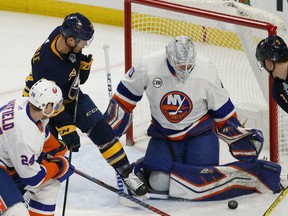 Buffalo Sabres forward Jason Pominville (29) is stopped by New York Islanders goalie Robin Lehner (40) during the first period of an NHL hockey game, Tuesday, Feb. 12, 2019, in Buffalo N.Y.