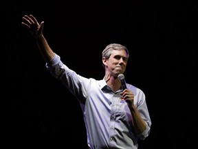 As the president filled an El Paso arena with supporters, O'Rourke helped lead thousands of his own on a protest march past the barrier of barbed-wire topped fencing and towering metal slats that separates El Paso from Ciudad Juarez, Mexico.