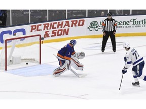 Tampa Bay Lightning's Victor Hedman (77) scores past New York Islanders goaltender Thomas Greiss (1) during the shootout in an NHL hockey game Friday, Feb. 1, 2019, in Uniondale, N.Y. The Lightning won 1-0.