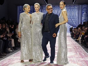 Models Alva Chinn, Karen Bjornson, and Pat Cleveland appear with fashion designer Naeem Khan, after walking the runway during the Naeem Khan show during New York Fashion Week, Tuesday, Feb. 12, 2019, in New York.