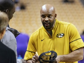 FILE - In this Jan. 26, 2019 file photo Missouri head coach Cuonzo Martin signs autographs for fans before an NCAA college basketball game against LSU in Columbia, Mo. Martin returns to Thompson-Boling Arena as a visiting coach for the first time Tuesday, Feb. 5, 2019 when his Missouri team faces the top-ranked Volunteers. Martin, who coached Tennessee from 2011-14 but never won over the fan base, now must try to snap the Vols' school-record 16-game winning streak.
